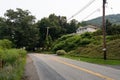 Empty Road with Green Trees and a Home in Cold Spring New York Royalty Free Stock Photo