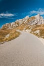 Empty road in high mountains in autumn colors Royalty Free Stock Photo