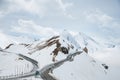 Empty road leading through scenic countryside, Snow & fog at Grossglockner mountain, Austria