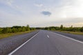 An empty road leading to the village on the hills.