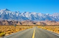 Empty road near Lone Pine with rocks of the Alabama Hills and the Sierra Nevada in the background, Inyo County, California, United Royalty Free Stock Photo