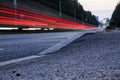 Empty road at night. The lights of the passing car, long exposure Royalty Free Stock Photo