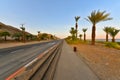 Road on the outskirts of Eilat by the coastline of the Red sea coral reef at sunset, Israel Royalty Free Stock Photo