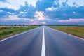 Empty road in the plain at dawn