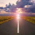 Empty road in the plain at dawn Royalty Free Stock Photo