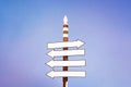 Empty road sign over perfectly clear blue sky background pointing to the right direction. Instagram style filtred image