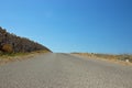 Empty Road with Stone Fence Royalty Free Stock Photo