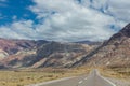 An empty road leading towards the Andes mountain range. It connects the cities Mendoza, Argentina to Santiago, Chile. Royalty Free Stock Photo