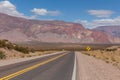 An empty road in Argentina leading towards the border with Chile in the Andes mountain range. Royalty Free Stock Photo