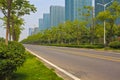 Empty road surface with modern city buildings background