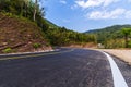Empty road in Thailand with the mountains and blue sky as background Royalty Free Stock Photo