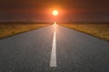 Empty road towards the sun at sunset Royalty Free Stock Photo