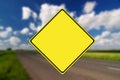 Empty road with yellow traffic sign Royalty Free Stock Photo