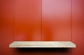 rock display shelf on Shiney red metal plate Royalty Free Stock Photo