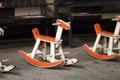 Empty rocking horse chair For children to play, fun and relax. Made of orange and white wood. Placed in a small children`s field Royalty Free Stock Photo