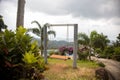 Empty romantic swing in a tropical paradise garden on a mountainside