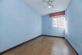 Empty room with aluminum window with sky blue painted walls, Royalty Free Stock Photo