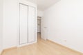 An empty room in an apartment with a built-in wardrobe