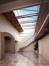 Empty room with rustic brick and ceiling skylights