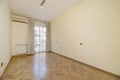 Empty room with balcony with white curtains and aluminum