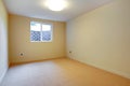 Empty room with beige carpet and small basement window. Royalty Free Stock Photo