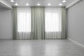 Empty room with wall, large window and wooden floor Royalty Free Stock Photo