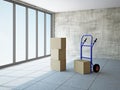 Empty room with boxes and pushcart