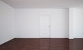 Empty room with a closed door and dark floor Royalty Free Stock Photo