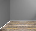 Empty room corner with wooden floor and grey wall Royalty Free Stock Photo