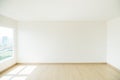 Empty room is decorated with an engineering wooden floor and wallpaper on the wall with sunlight from the window. Minimalist Royalty Free Stock Photo