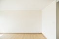 Empty room is decorated with an engineering wooden floor and wallpaper on the wall with sunlight from the window. Minimalist Royalty Free Stock Photo