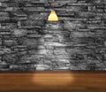 Empty room - granite stone decorative brick wall with lamp and laminate flooring interior background Royalty Free Stock Photo