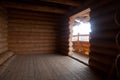 Empty room inside a new wooden log house Royalty Free Stock Photo