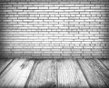 Empty room interior: brick wall and wooden floor