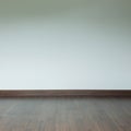 Empty room interior, brown wood laminate floor and white mortar Royalty Free Stock Photo