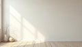 Empty room interior features clean beige wall, light wooden floor. Sunlight streams from window, casts striking shadow patterns Royalty Free Stock Photo