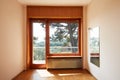 Empty room interior with large window and wooden floor in country house, sunlight Royalty Free Stock Photo