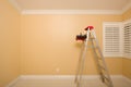 Empty Room with Ladder, Paint Tray and Rollers Royalty Free Stock Photo