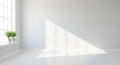 Empty Room with Large Window Casting Sunlight Shadows on White Walls and Floor interior minimalist Royalty Free Stock Photo