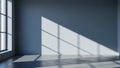 Empty room with large windows casting geometric light and shadow patterns Royalty Free Stock Photo