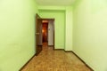 Empty room with light green painted walls, oak parquet flooring Royalty Free Stock Photo