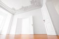 Empty room in luxury apartment flat with wooden floor and stucco ceiling Royalty Free Stock Photo