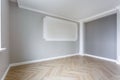 Empty room with minimal preparatory repairs with crown molding. interior of white and gray walls