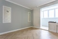 Empty room with minimal preparatory repairs with crown molding. interior of white and gray walls