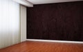 Empty room is newly renovated. In the interior there are blinds and baseboards and wallpaper with a pattern.