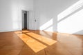 Empty room in old apartment building with wooden parquet floor - Royalty Free Stock Photo
