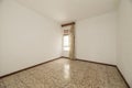 Empty room with old terrazzo floor, white walls and window Royalty Free Stock Photo