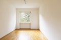 Empty room with parquet. Bright window with a view of nature Royalty Free Stock Photo