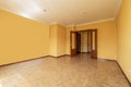 An empty room with a sapele wood double door with French windows