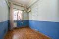 Empty room with sintasol floors, walls painted in two shades of blue and aluminum window